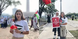 Potret Najwa Shihab Ikut Aksi Bela Palestina di Monas - Bagikan Seribu Semangka Kepada Pendemo Lainnya