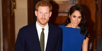 Gandeng Pangeran Harry, Meghan Markle Pakai Dress Belahan Tinggi