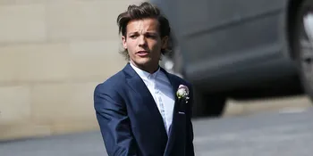 So Sweet! Louis Tomlinson Jalani Pemotretan Bareng Bayi Mungilnya