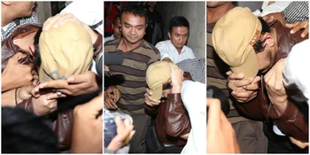 Guntur Bumi Tutupi Wajah Saat Digelandang Kepolisian