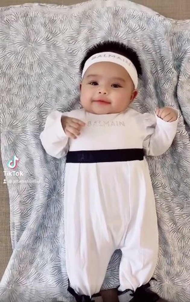 7 Adorable Portraits of Baby Ameena with Her Curly Hair, Wearing a Bandana Resembling Atta Halilintar