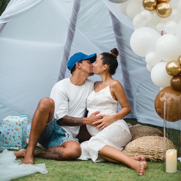7 Portraits of Jennifer Bachdim's Baby Shower, Held Outdoors with Lots of Balloons - Showing Affectionate Kisses with Husband