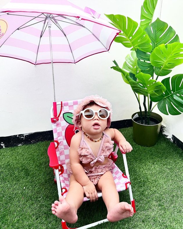 8 Baby Bible Photoshoot of Felicya Angelista and Caesar Hito's Cute Baby in Bikini, So Adorable - Relaxing Sitting on a Chair and Under an Umbrella