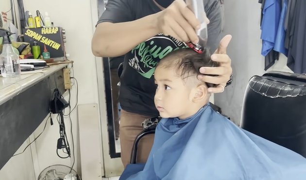 Known as the Sultan's Child, Portrait of Kiano, Baim Wong's Son, Getting a Haircut at the Barber