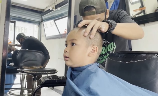 Known as the Sultan's Child, Portrait of Kiano, Baim Wong's Son, Getting a Haircut at the Barber