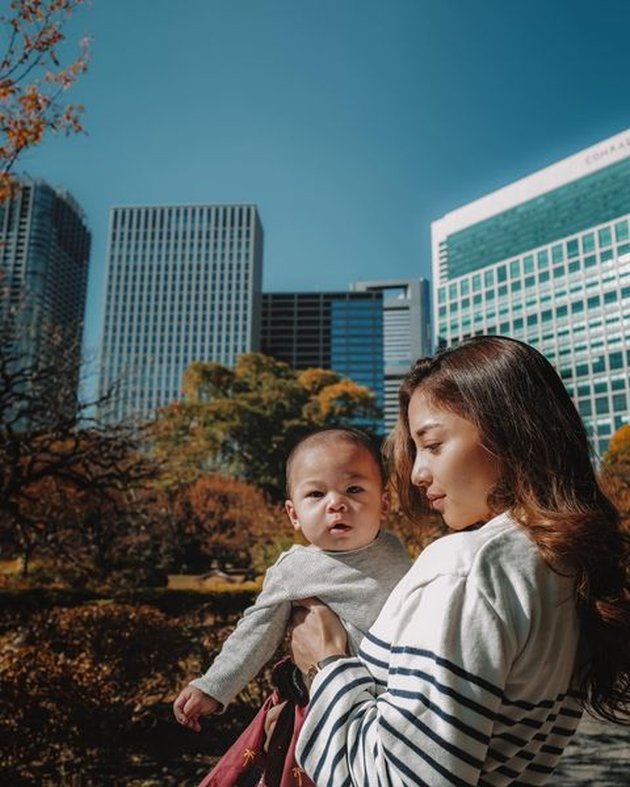 Photos of Adorable Baby Issa, Nikita Willy's Child, While Strolling in Tokyo, Relaxing on the Grass - Exciting Subway Ride