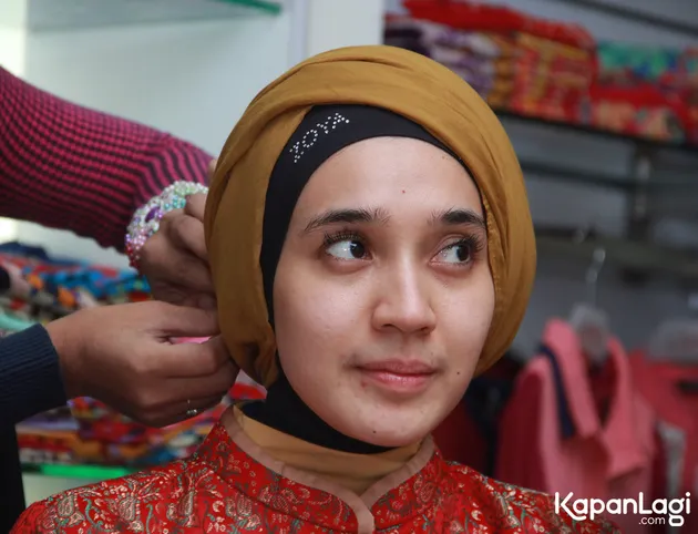 Dhini Aminarti