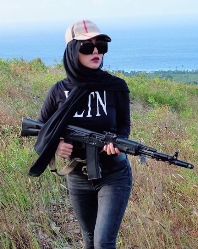 Hot Mom Bella Shofie Practicing Shooting at the Top of the Mountain, Wearing Branded OOTD