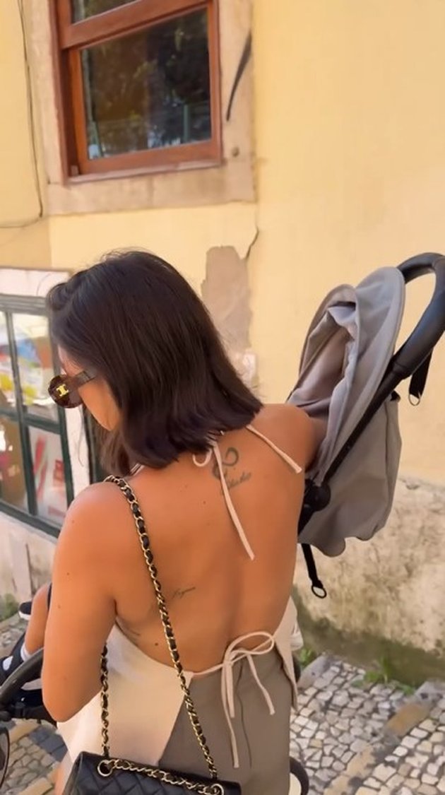 Holiday to Portugal, Jennifer Bachdim's Portrait Willing to Lift and Push Strollers for the Sake of Her Children's Happiness