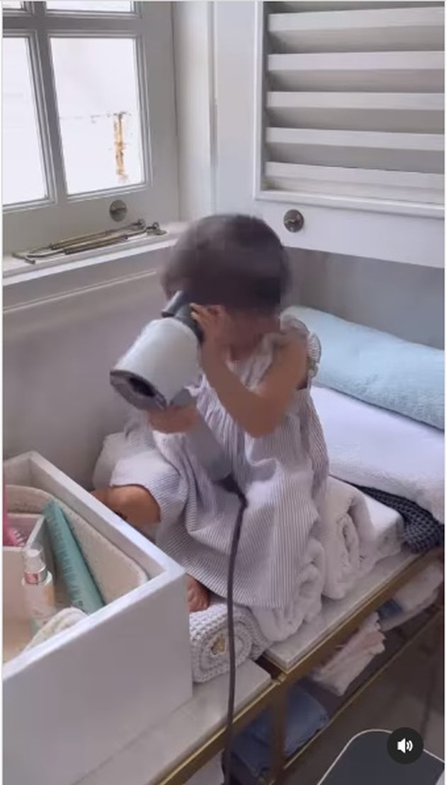 Enjoying Once, Here are 11 Cute Photos of Baby Claire Playing with a Hair Dryer - Her Expressions are Adorable, She Even Combs Her Own Hair