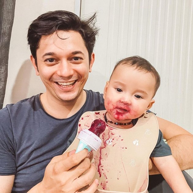 Portrait of Happy Andrew Andika with Baby Eshan, Very Caring Father!