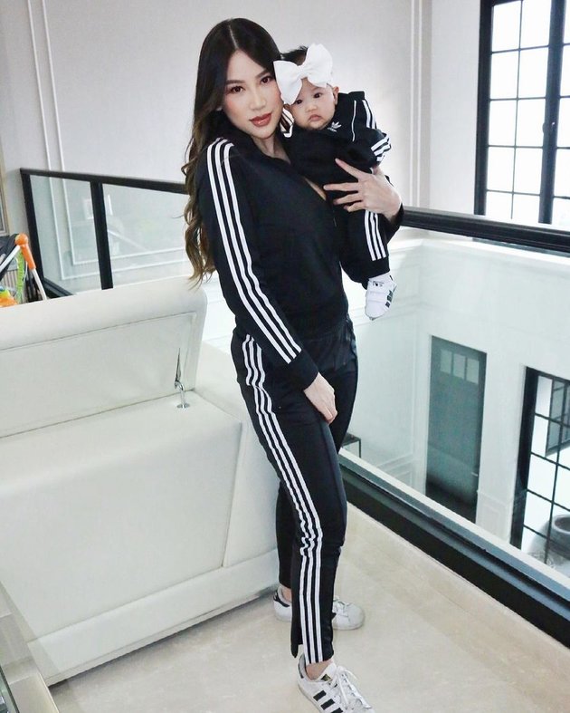 Portrait of Kezia Toemion Twinning with Kelly The Princess, Hot Mom and Cute Baby in Branded Clothes