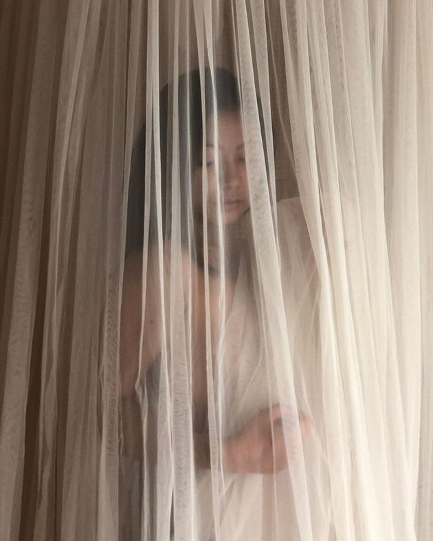 Portrait of Mayang Sary Often Referred to as 'Younger Sister' Vanessa Angel Topless Pose Only Covered by Curtains, Writes Caption: Born to Make History