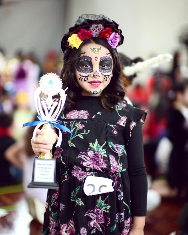 Creepy Portrait of Rionaldo Stockhorst's Child in Halloween Costume, Knife Stuck in the Head