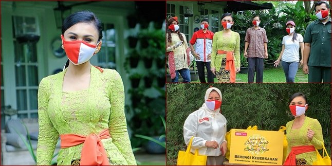6 Beautiful Photos of Yuni Shara Distributing Groceries to Residents while Wearing Kebaya on Kartini Day