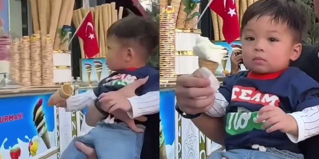 Cool Abis, 9 Photos of Baby Izz, Nikita Willy's Child, Watching Turkish Ice Cream Seller in Action - Expression Doesn't Change
