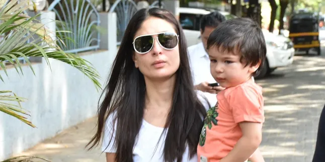 Diajak Kareena Kapoor Jalan-Jalan di London, Taimur Asyik Main HP