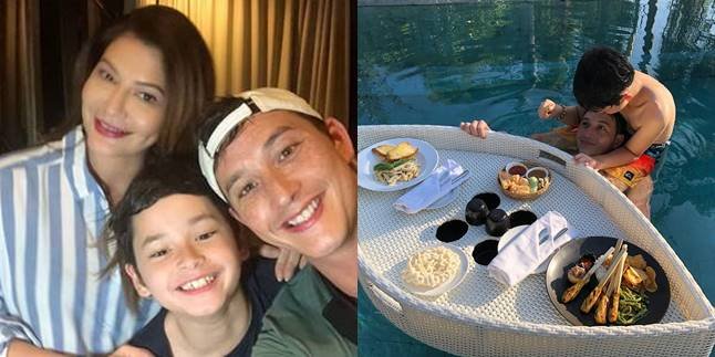 Sweet Togetherness of Mike Lewis and His Son, Eating Satay by the Pool