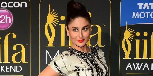 Modis! Paduan Topi & Vest Kareena Bikin Bandara Serasa Catwalk