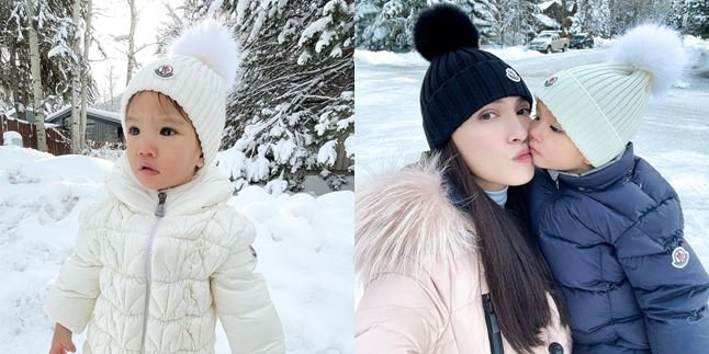 Using Socks as Oversized Gloves, Here's a Picture of Shandy Aulia's Daughter Claire Playing in the Snow Until Her Nose Turns Red