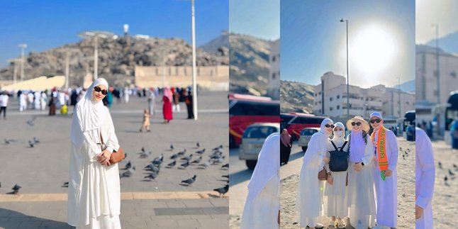 Portrait of Ayu Ting Ting Wearing All-White Gown During Umrah with Family