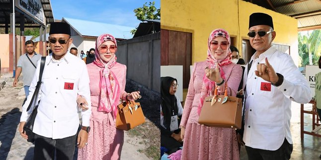 Portrait of Bella Shofie Voting in the Regional Election Accompanying Her Husband Running for Regent of Buru Regency