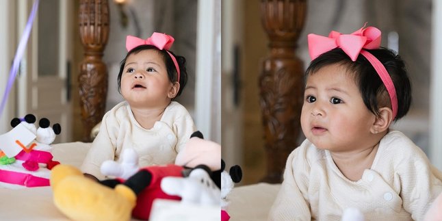 Portrait of Lily with a Pink Bow on Her Head, Super Cute Pose on the Bed