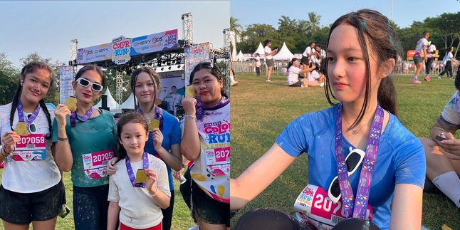 Portrait of Ussy Sulistiawaty Participating in Color Run Festival 2024 with Her Children, Elea's Beauty Always Shines