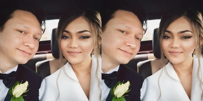 Cantiknya Gaun Pernikahan Rina Nose, Bahagia Pose di Depan Kincir Angin