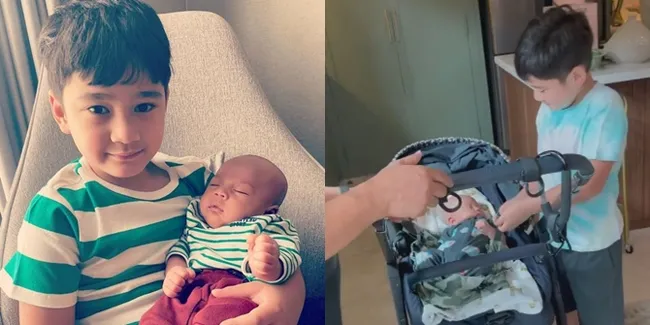 Sayang Adik, Ini Sederet Foto Rafathar Malik Ahmad Ikut Momong Baby Rayyanza: Berani Gendong Sampai Dorong Stroller