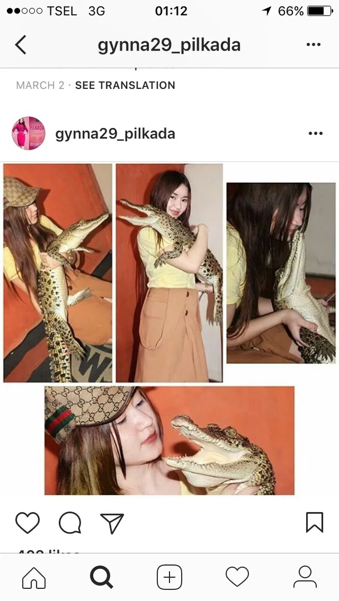 foto gendong buaya, pedangdut cantik ini tuai kontroversi