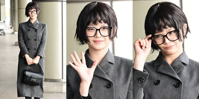 9 Potret Hanni NewJeans di Bandara, Curi Perhatian Pakai Wig Bondol dan Setelan Blazer - Disebut Mirip Karakter Edna Mode