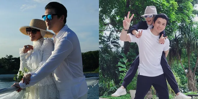 Potret Mesra Syahrini dan Reino Barack di Tokyo Disneyland, Saling Pegangan Tangan yang Erat - Romantis Jalan Berdua Dikala Hujan