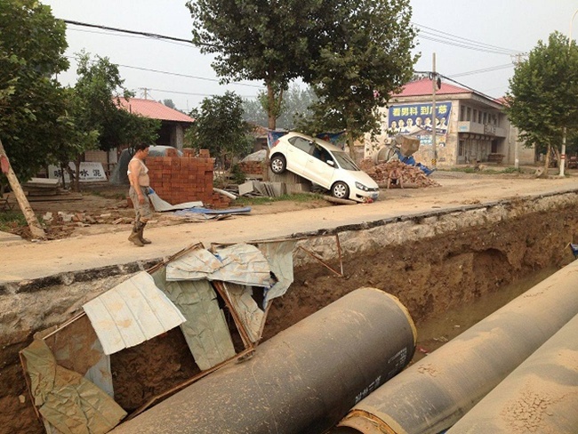 Kondisi desa Gao setelah banjir surut | Photo: Copyright shanghaiist.com